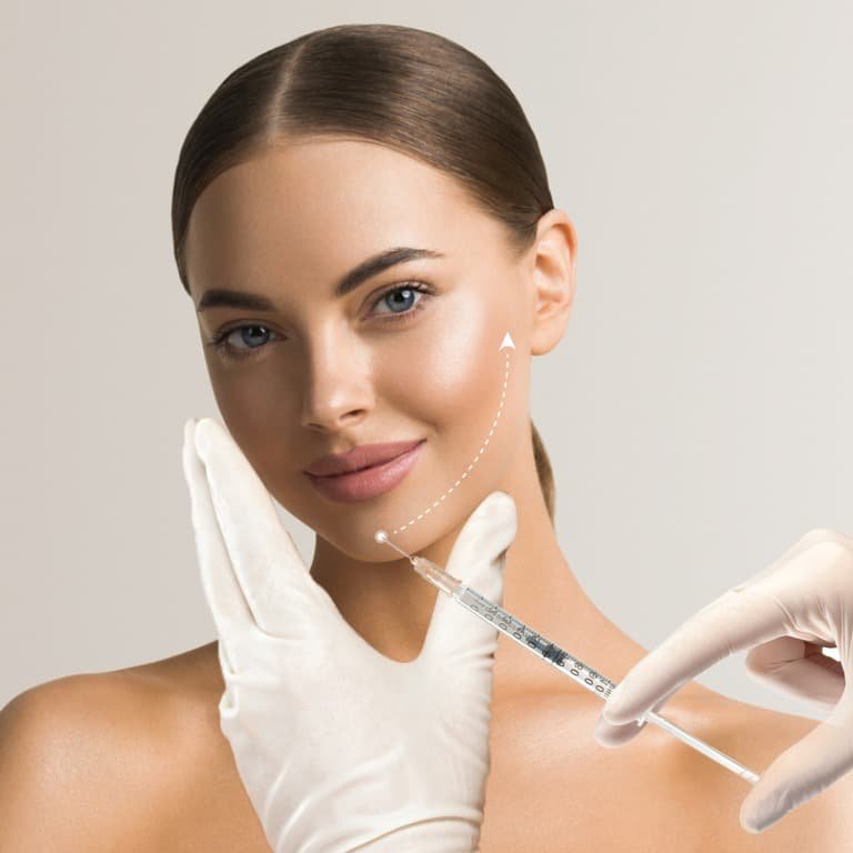 women undergoes her Chin and Jawline Sculpting with smile
